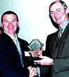 Kevin Clack (left) receiving the DTI award from Alec Erwin, minister of trade and industry